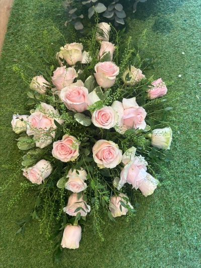 Blush Spray - A beautifully arranged spray in delicate pastel shades, offering a simple and elegant expression of sympathy.