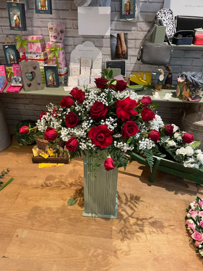 Crimson Spray - A striking spray designed to create a beautiful focal point, offering a heartfelt expression of love, respect and remembrance.