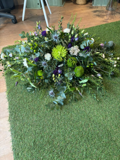 Natural Woodland Spray - A flowing, nature-inspired tribute with an elegant, organic style, thoughtfully designed to honour a life with beauty and grace.